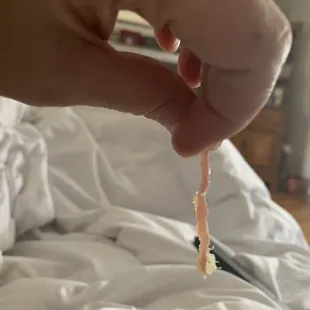 a hand holding a toothbrush