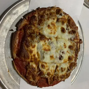 two pizzas on a table