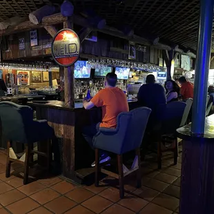 people sitting at the bar