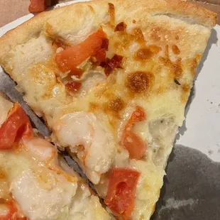 We see shrimp tomatoes and what looks like to be hot pepper. Mixed with the tomatoes.