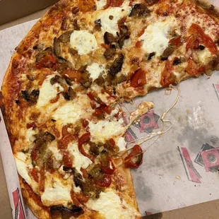 a half eaten pizza in a box