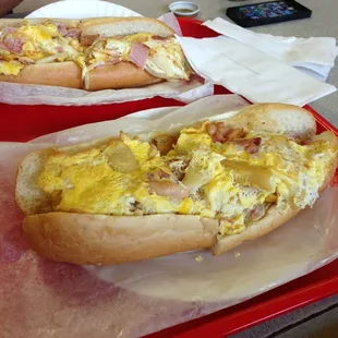Breakfast omelette bacon eggs and cheese...on awesome roll
