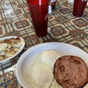 Two eggs, ham and home fries