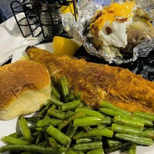 Pan fried walleye, loaded baked potato, fresh green beans, and a roll.
