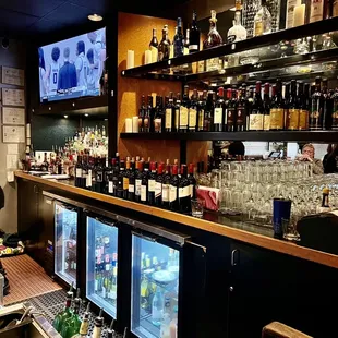 a bar filled with bottles of alcohol