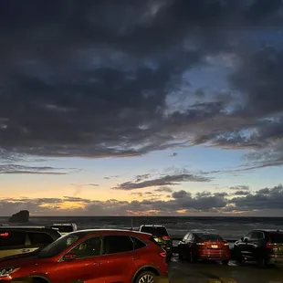Gorgeous sunset after a rainy evening. Careful if parking by the rocks as the waves were huge and would spray the cars