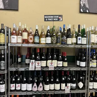 a shelf of wine bottles