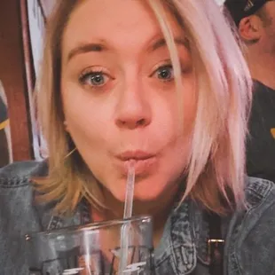 a woman drinking a drink