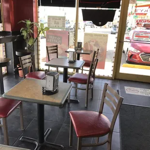 ows tables and chairs in a restaurant