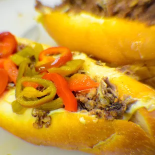 two hot dogs with peppers