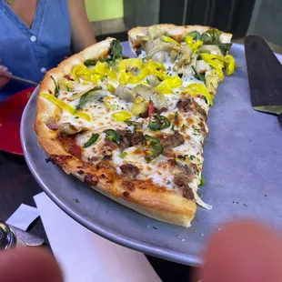a slice of pizza on a pan