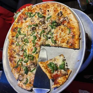 Medium thin crust with jalapeños and mushrooms