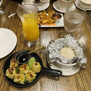 Pork dumplings, sticky white rice, mango juice.