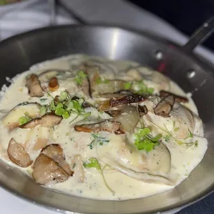 Porcini Ravioli  White Truffle Cream Sauce, Exotic Mushrooms, Parmigiana