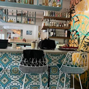 a bar with two stools