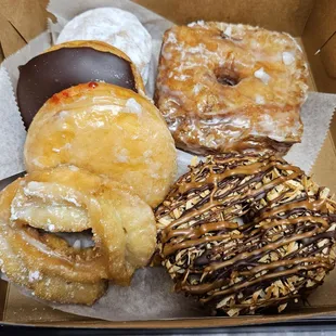 Cronut, Samoa, sour cream, guava filled, jelly filled and Bavarian filled