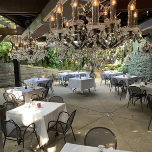 Nicola&apos;s updated Garden patio with awning allows for outside fine dining all year round!