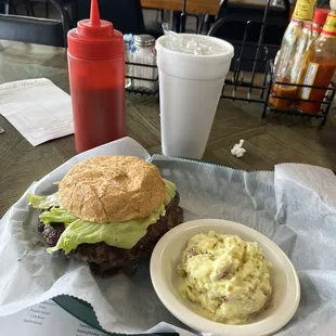 Big cheese showing size of burger to the bun!