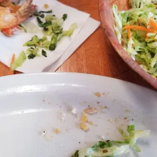 Picking thru the side salad, which was old and had slimy lettuce.