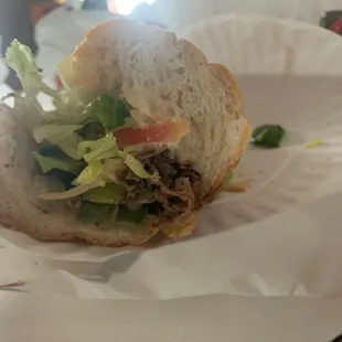 a sandwich on a paper plate