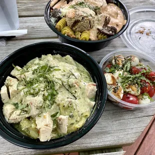 Rigatoni pasta with chicken mixed with pesto and alfredo sauce + radiatori with vegan meat balls and cremini mushrooms &amp; caprese salad