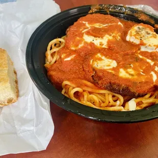Eggplant parmegian over spaghetti