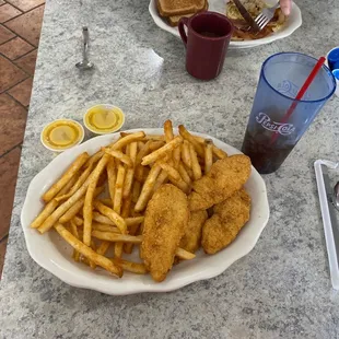 a plate of fried fish and french fries