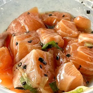 Salmon Poke. Sesame oil coated, it's a fresh fatty fish, which is more tender and squishy. Highly recommend this.