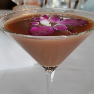 a martini with a flower in it