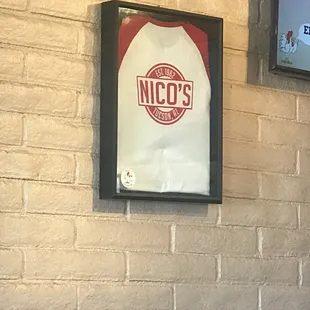 a sign on a brick wall