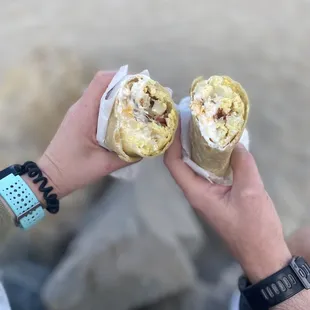 Breakfast burrito with bacon, egg, potato, cheese, and sour cream