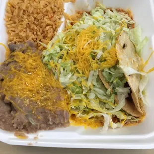 #1 Combo Plate: 1 cheese enchilada, 1 shredded beef taco, refried beans and Spanish rice
