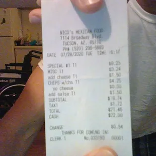 a man holding a receipt