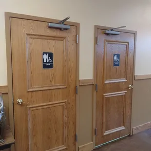 two wooden doors in a room