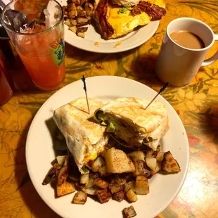 Forgive my sins of last night wrap with added bacon and home fries on the side and biscuit sandwich in the background