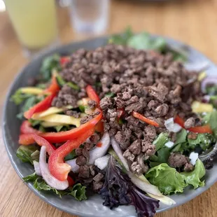 Mixed greens with steak