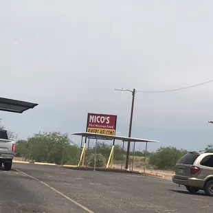 a car parked in front of a taco shop