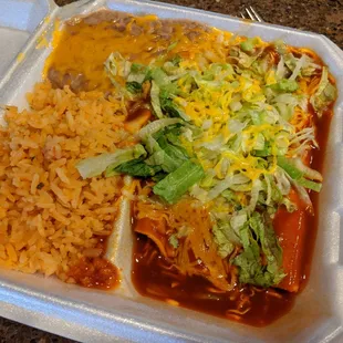 Cheese enchiladas with rice and beans.