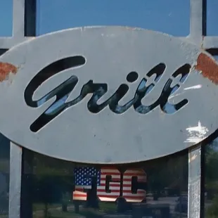 a reflection of an american flag in a window