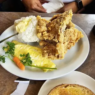 Fried pork chops with eggs &amp; rice.