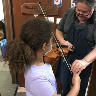Outfitting a fourth grader with her first viola.