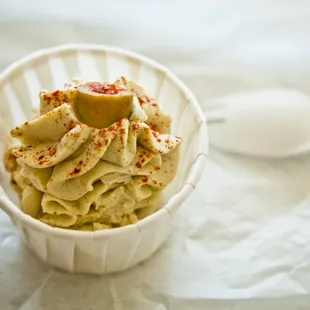 a bowl of pasta and a spoon