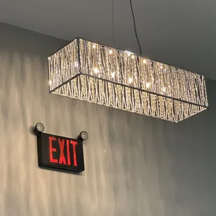 exit sign and chandelier