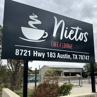 a sign for nietos cafe and lounge