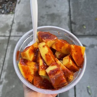 a person holding a bowl of food