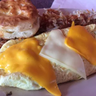 Ham and cheese western omelette with hashbrown and biscuit