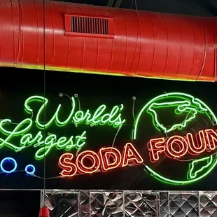 a neon sign for a soda fountain