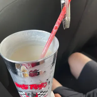 a drink in a cup with a straw