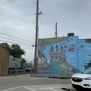 a white suv parked in a parking lot