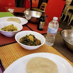 Gari, vegetable soup and egusi soup